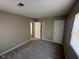 Spacious bedroom featuring neutral paint, carpeted floors, with two closets and natural light from a window at 3060 S Lyons Ave, Indianapolis, IN 46241
