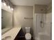 Bright bathroom features a shower, a toilet, and a vanity with a sink at 320 Lakewood Ct, Avon, IN 46123