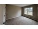 Comfortable bedroom with neutral carpet, light walls, and window views at 320 Lakewood Ct, Avon, IN 46123