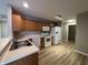 Functional kitchen with light wood cabinets, modern appliances, and vinyl floors at 320 Lakewood Ct, Avon, IN 46123