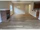 Open-concept living room featuring hardwood floors, a classic fireplace, and neutral paint colors at 320 Lakewood Ct, Avon, IN 46123