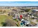 Aerial view of a residential neighborhood with an in-ground pool and lush landscaping at 3932 Villa Dr, Columbus, IN 47203
