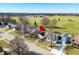 Aerial view of a charming home in a quiet neighborhood with an adjacent green space at 3932 Villa Dr, Columbus, IN 47203