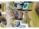 This aerial view shows a home's roof, yard, community, and nearby pool at 3932 Villa Dr, Columbus, IN 47203