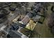 Aerial view of a charming home with a spacious backyard, storage shed and mature trees at 3932 Villa Dr, Columbus, IN 47203