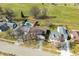 Bird's eye view of a residential neighborhood with homes with mature trees and green lawns at 3932 Villa Dr, Columbus, IN 47203
