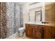 Bathroom with zebra shower curtain, vanity, tile floor, and a light fixture at 3932 Villa Dr, Columbus, IN 47203