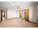 Bedroom with carpet, neutral walls, closet, and doorways to other rooms at 3932 Villa Dr, Columbus, IN 47203