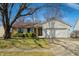 Charming home with a well-maintained lawn and an attached two-car garage at 3932 Villa Dr, Columbus, IN 47203