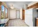 Bright kitchen featuring tile floors, modern appliances, and an adjacent dining space at 3932 Villa Dr, Columbus, IN 47203