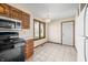 Bright kitchen area featuring tile floors, modern appliances, and an adjacent dining space at 3932 Villa Dr, Columbus, IN 47203