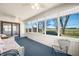 Bright sunroom with many windows, a ceiling fan and wicker furniture at 3932 Villa Dr, Columbus, IN 47203