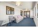 Inviting sunroom with lots of natural light, comfortable seating and a ceiling fan at 3932 Villa Dr, Columbus, IN 47203