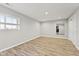 Bright bedroom with neutral paint, wood-look floors, and natural light from large window at 4094 Sunnyside Ct, Danville, IN 46122