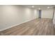 Large basement with wood-look floors, neutral paint, recessed lighting, and white trim and baseboards at 4713 Calhoun St, Indianapolis, IN 46203