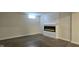 Finished basement with electric fireplace and plank flooring at 4713 Calhoun St, Indianapolis, IN 46203
