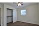 Cozy bedroom with neutral carpet, ceiling fan, and closet at 4713 Calhoun St, Indianapolis, IN 46203