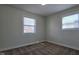 Simple bedroom featuring carpet, neutral walls, and two windows at 4713 Calhoun St, Indianapolis, IN 46203