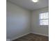 Comfortable bedroom featuring neutral walls, carpet, and a window at 4713 Calhoun St, Indianapolis, IN 46203