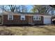 Charming brick home featuring updated windows and a well-maintained front yard at 4713 Calhoun St, Indianapolis, IN 46203