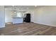 Open-concept living space connecting to a kitchen with modern appliances at 4713 Calhoun St, Indianapolis, IN 46203