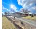 Charming single-story brick home featuring a well-manicured front yard and a private driveway on a sunny day at 505 Birch St, Beech Grove, IN 46107