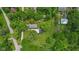 Aerial view of a house and garage with lush green trees and foliage surrounding the property at 5533 Wilson Way, Jamestown, IN 46147