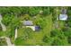 Aerial view of a property showing the house, garage, and surrounding green landscape at 5533 Wilson Way, Jamestown, IN 46147