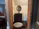 Cozy bathroom features a vanity with a round mirror, a toilet and wooden closet doors at 5533 Wilson Way, Jamestown, IN 46147