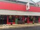 Churubella's storefront with red facade and front benches at 5533 Wilson Way, Jamestown, IN 46147