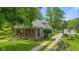 Charming single-Gathering home with landscaped front yard, inviting porch, and gravel driveway at 5533 Wilson Way, Jamestown, IN 46147