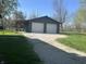 Exterior shot of the home's detached two-car garage with an attached open storage area at 5533 Wilson Way, Jamestown, IN 46147