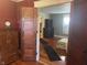 View through doorways into living room with polished hard wood floors and vintage furniture at 5533 Wilson Way, Jamestown, IN 46147