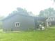 Outbuilding with covered parking and an ample yard is located in a serene environment at 5533 Wilson Way, Jamestown, IN 46147