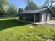 View of the metal outbuilding with covered porch, with two bays for parking, offering space for hobbies or storage at 5533 Wilson Way, Jamestown, IN 46147