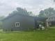 Metal outbuilding with a covered area, perfect for storing cars and equipment or hobbies and DIY projects at 5533 Wilson Way, Jamestown, IN 46147
