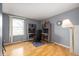 Office in a bedroom with a desk, wood floors, and natural light at 6440 Watercrest Way, Indianapolis, IN 46278