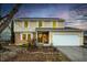Charming two-story home featuring neutral siding, brick accents, and a two-car garage at 6440 Watercrest Way, Indianapolis, IN 46278