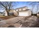 Two-story home featuring neutral siding, brick accents, two-car garage, and a long drive at 6440 Watercrest Way, Indianapolis, IN 46278