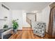 Bright living room with hardwood floors, ample space, and staircase at 6440 Watercrest Way, Indianapolis, IN 46278