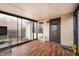 Bright sunroom featuring wood floor and access to the backyard at 6440 Watercrest Way, Indianapolis, IN 46278