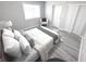 Cozy bedroom with white walls, wood-look floors, and a comfortable chair by the window at 7807 Inverness Dr, Indianapolis, IN 46237