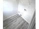 Spacious closet with a wire shelf and wood-look floors, offering ample storage and organization at 7807 Inverness Dr, Indianapolis, IN 46237