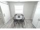 Cozy dining room features a modern table with seating for four at 7807 Inverness Dr, Indianapolis, IN 46237