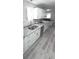 Stylish kitchen features stainless steel appliances, light countertops, and ample cabinet space at 7807 Inverness Dr, Indianapolis, IN 46237