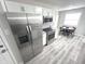 Charming kitchen features stainless steel appliances, granite countertops, and a cozy breakfast nook at 7807 Inverness Dr, Indianapolis, IN 46237