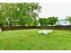 Spacious, fenced backyard featuring a garden bed, providing plenty of room for outdoor activities at 812 Madison St, Frankton, IN 46044