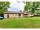 The backyard features a covered patio area offering a relaxing outdoor space at 812 Madison St, Frankton, IN 46044