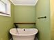 Bathroom with clawfoot tub, and modern fixtures with green walls at 812 Madison St, Frankton, IN 46044