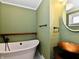 Bathroom featuring a unique sink, clawfoot tub, and modern fixtures at 812 Madison St, Frankton, IN 46044